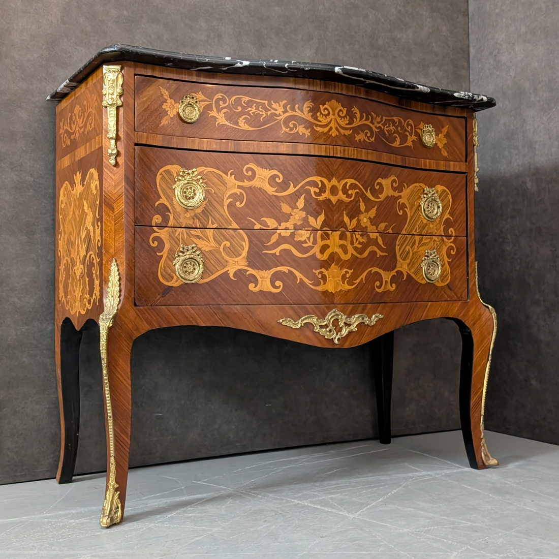 Circa 1930 French Louis XV Marquetry Commode with Black Marble Top
