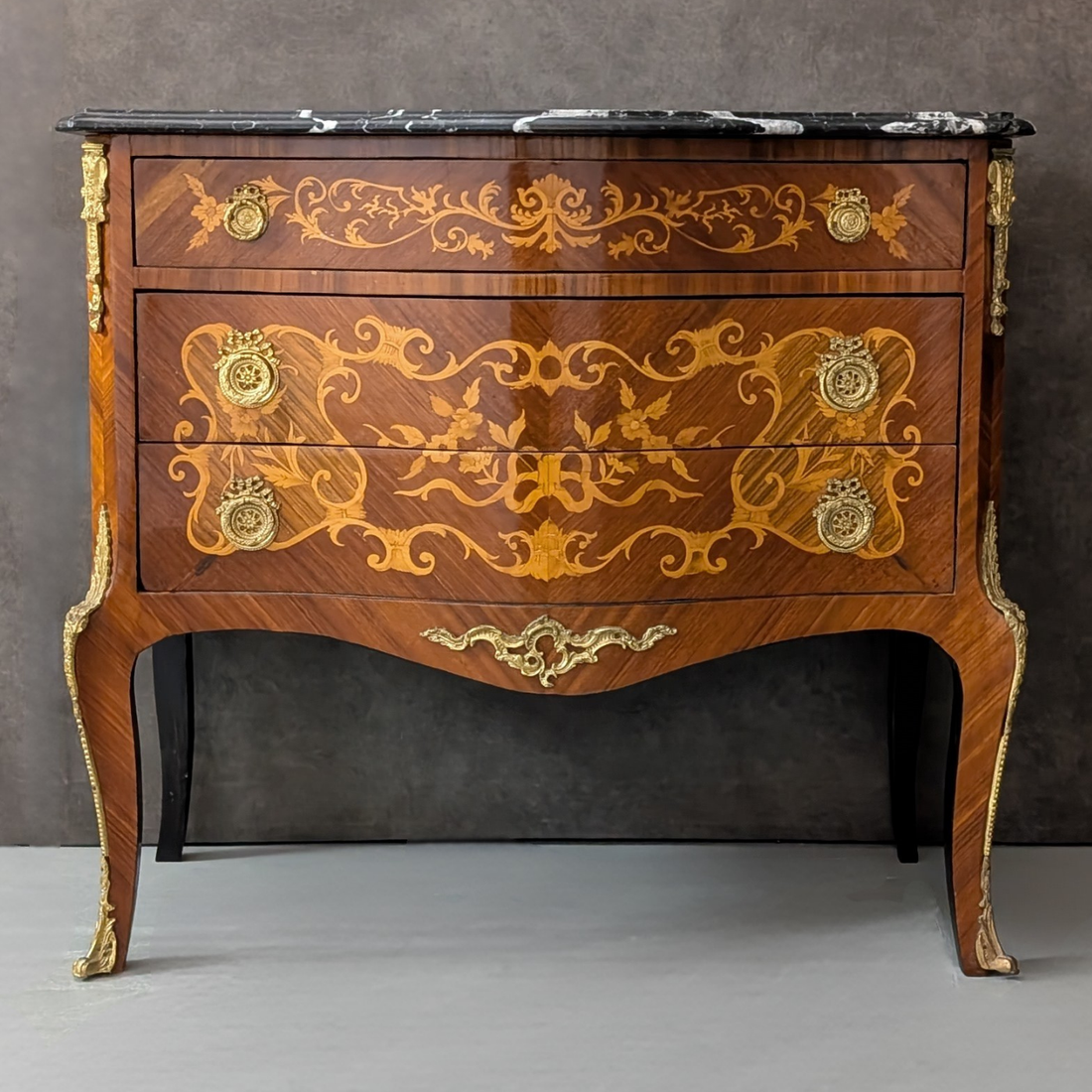 Circa 1930 French Louis XV Marquetry Commode with Black Marble Top
