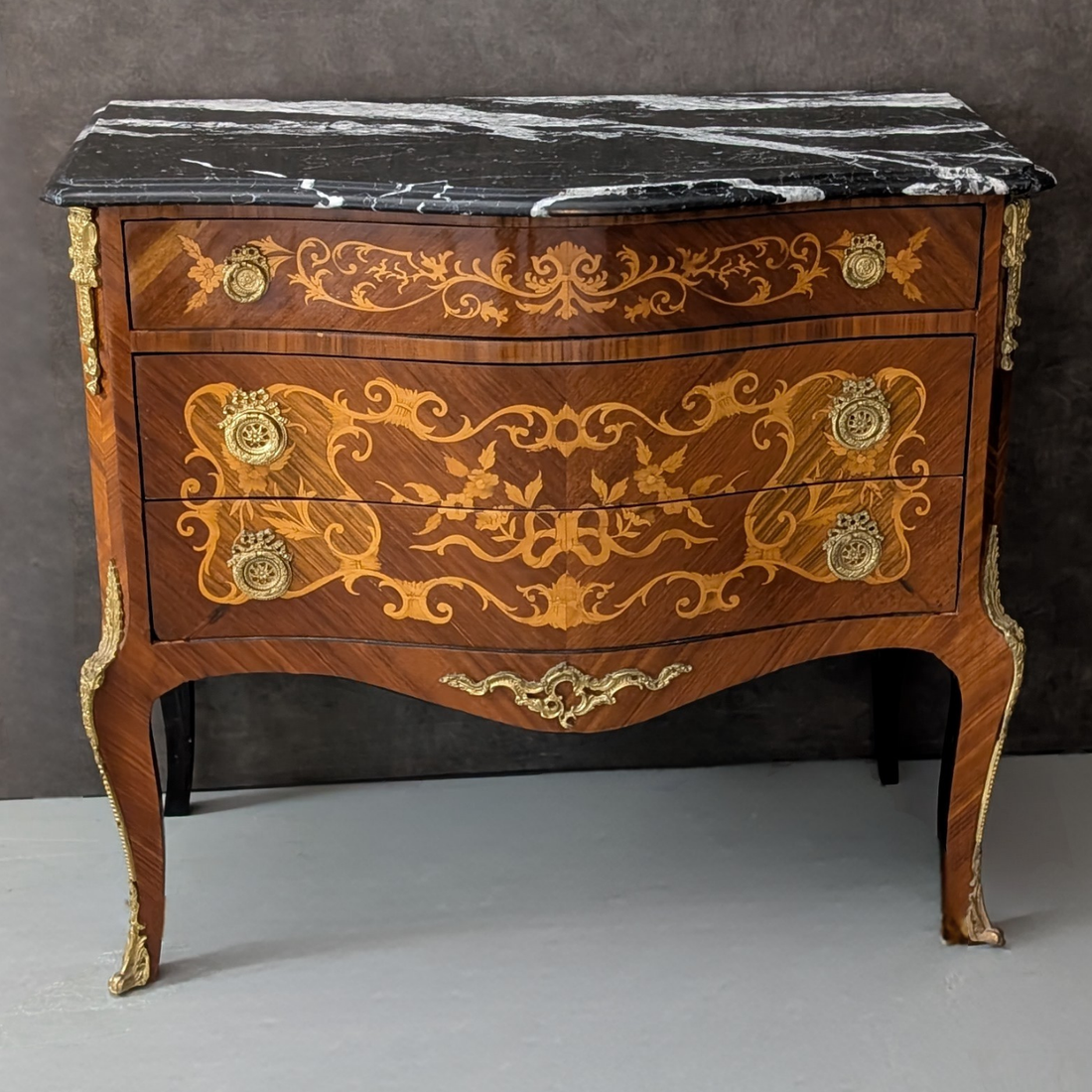 Circa 1930 French Louis XV Marquetry Commode with Black Marble Top