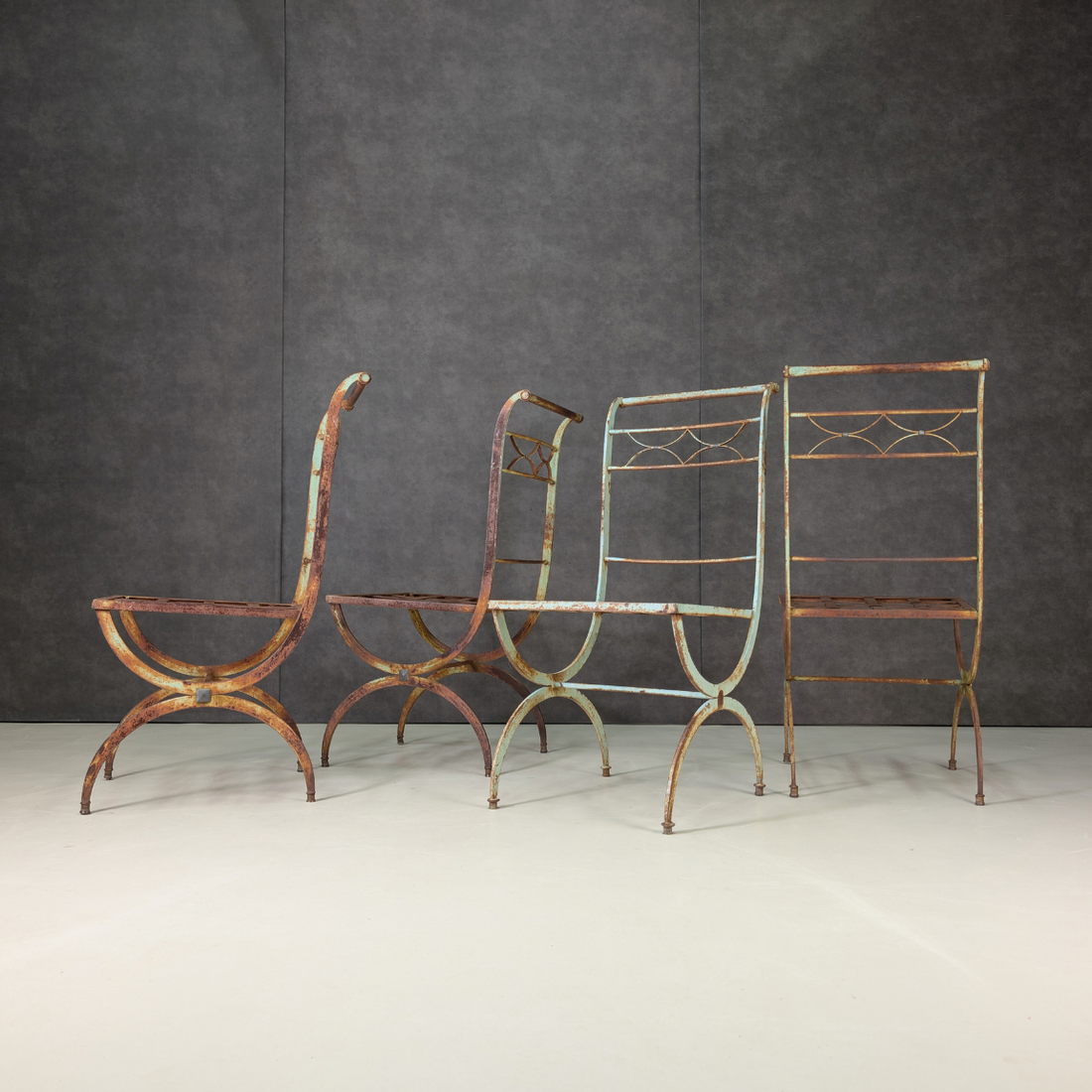Four Early to Mid Twentieth Century Wrought Iron Garden Chairs in the French Tradition