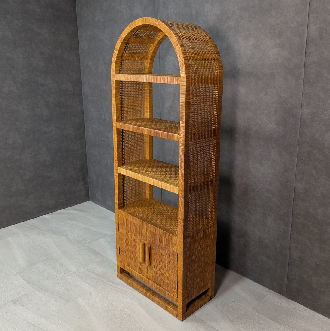 Arched vintage rattan bookcase with removable central shelves and woven construction