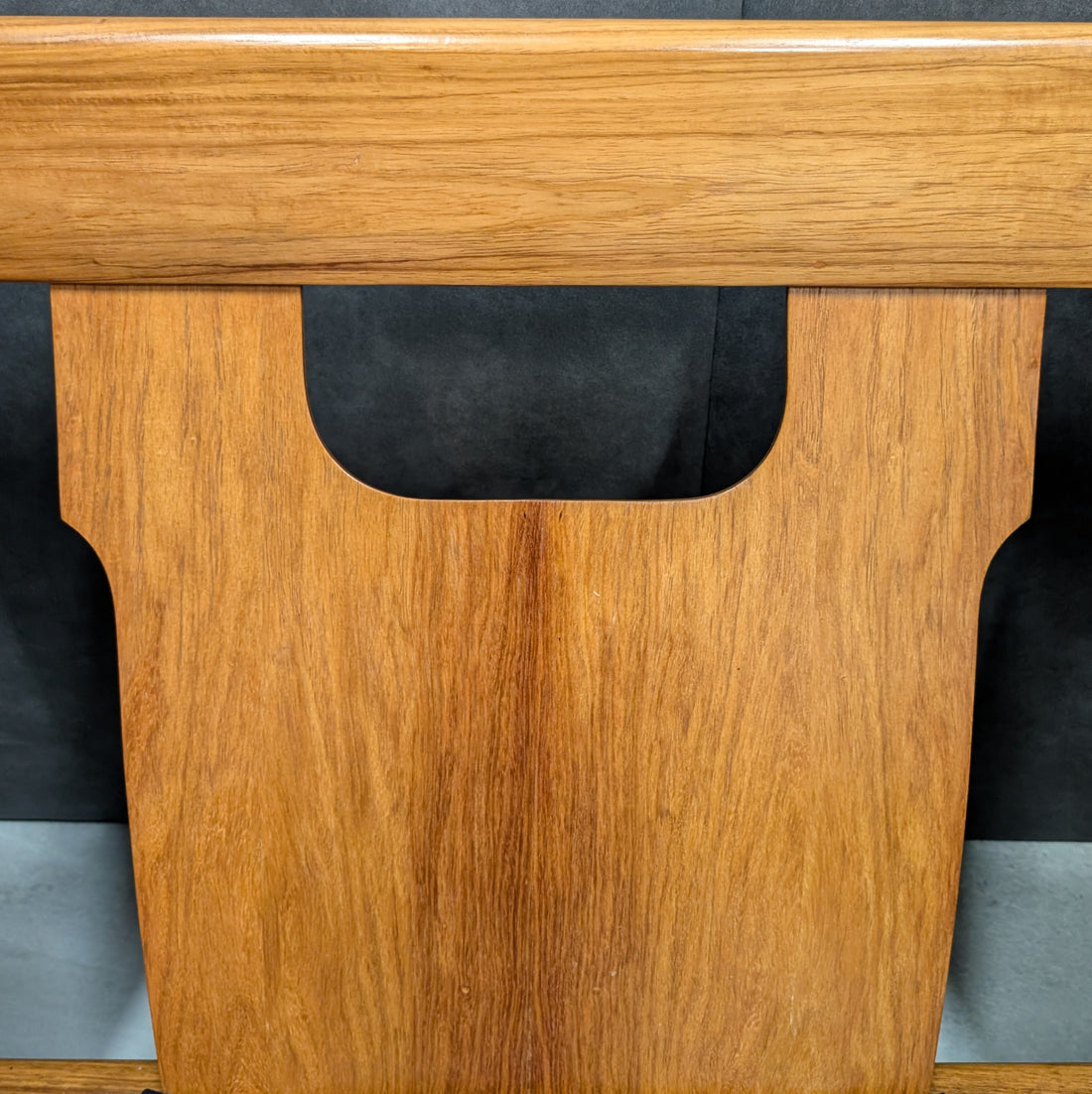 Close up of New Guinea rosewood backrest grain and timber cutout detail