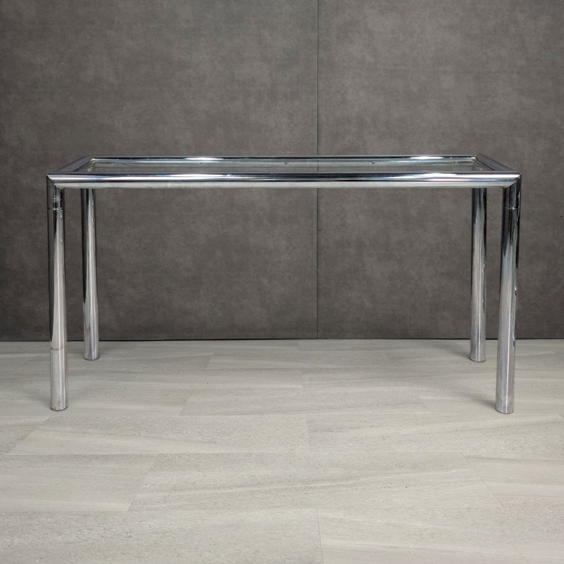 1970s tubular chrome console table showing its shallow rectangular profile