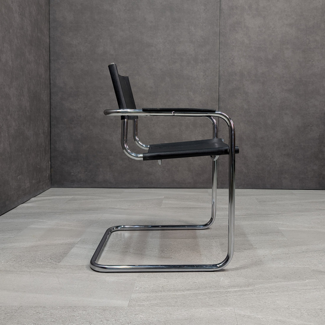 Pair of circa 1970s Bauhaus style black leather and polished chrome cantilever armchairs