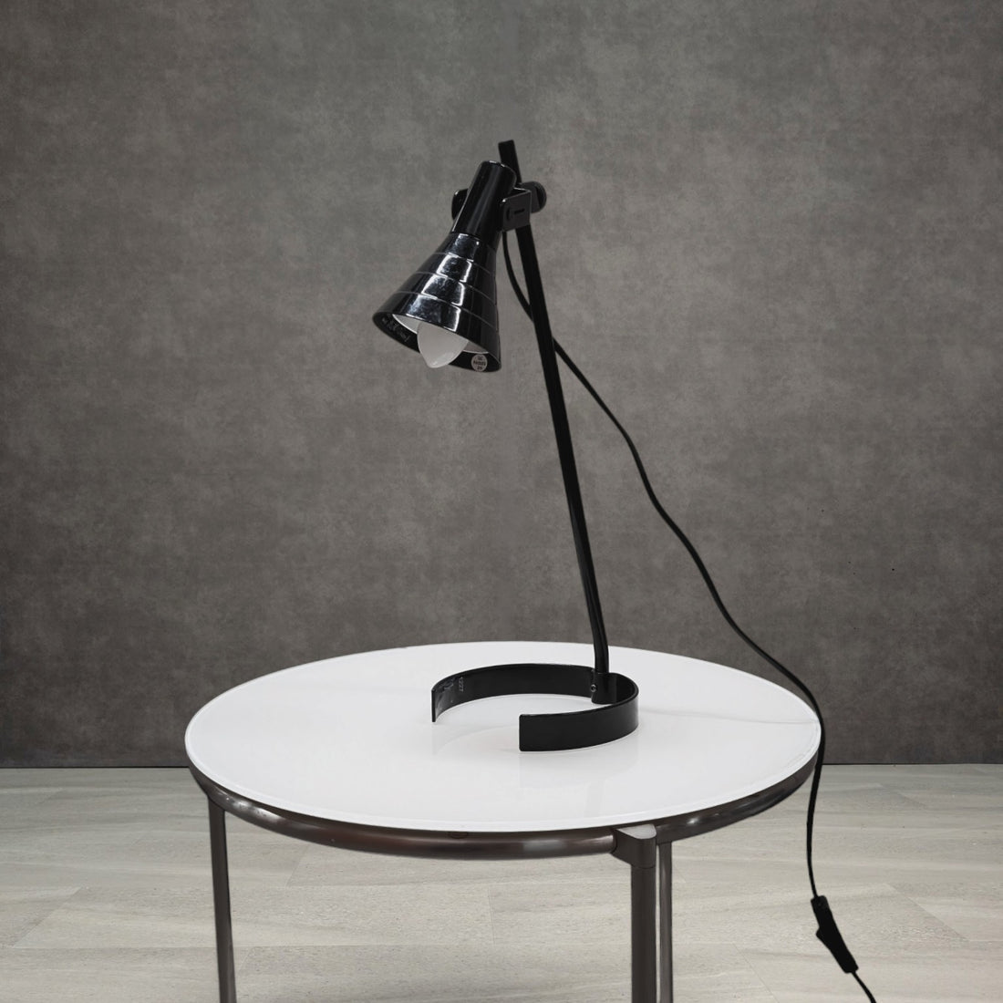 Vintage black IKEA LAGRA desk lamp with circular open base and ribbed cone shade