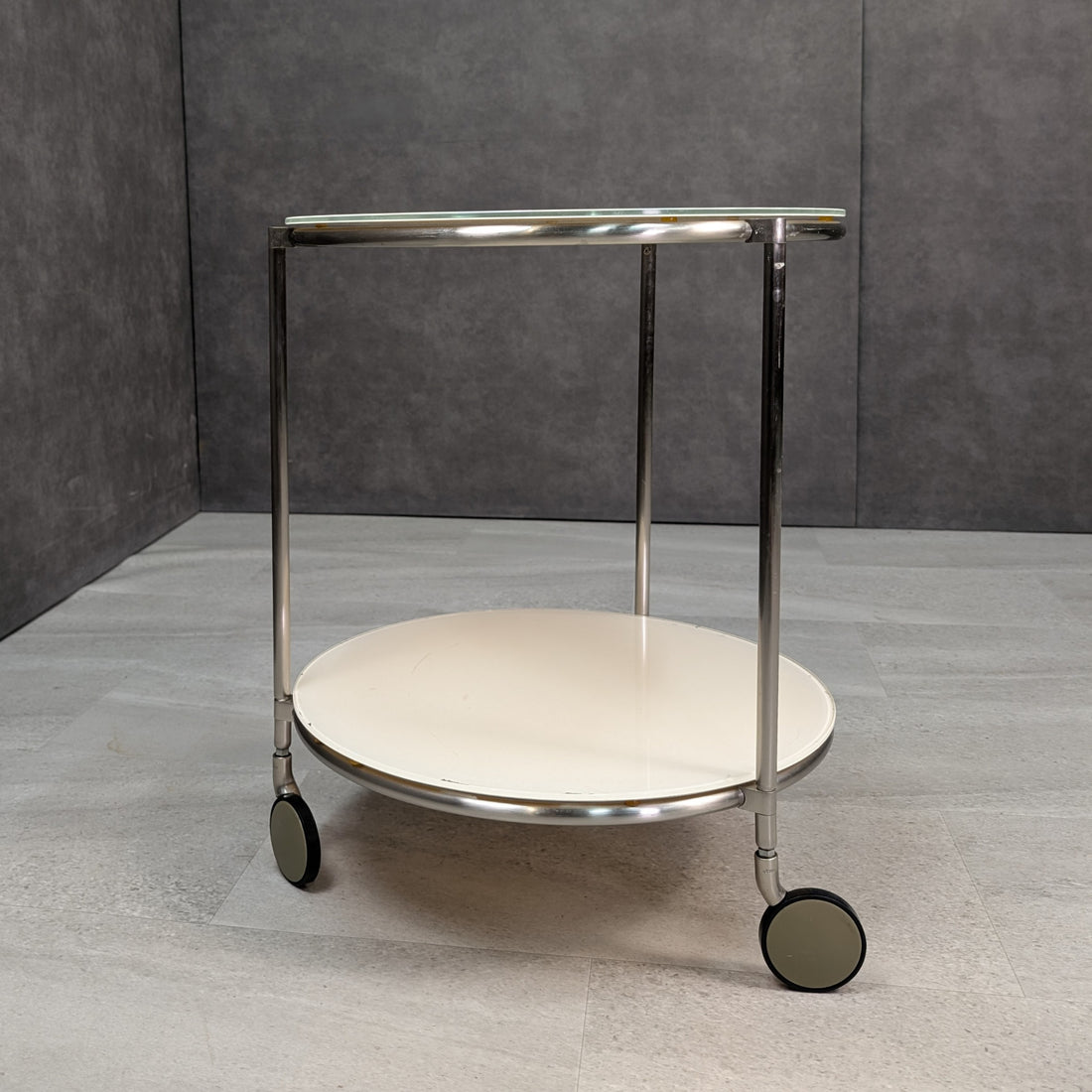 IKEA Strind chrome side table with lower shelf and castors