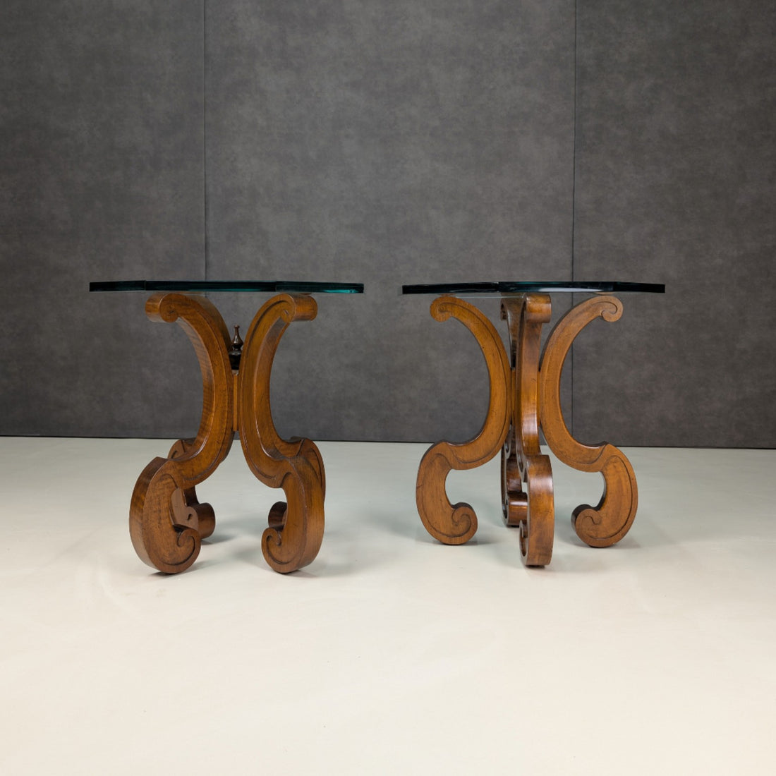 Front view of the pair showing octagonal 19mm glass tops and open timber scroll bases