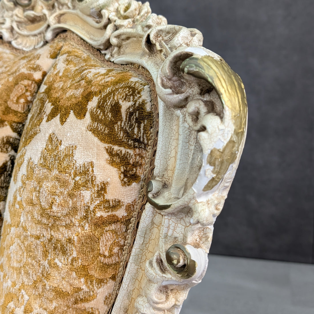 Detail of cream crackle finish and carved Rococo ornament