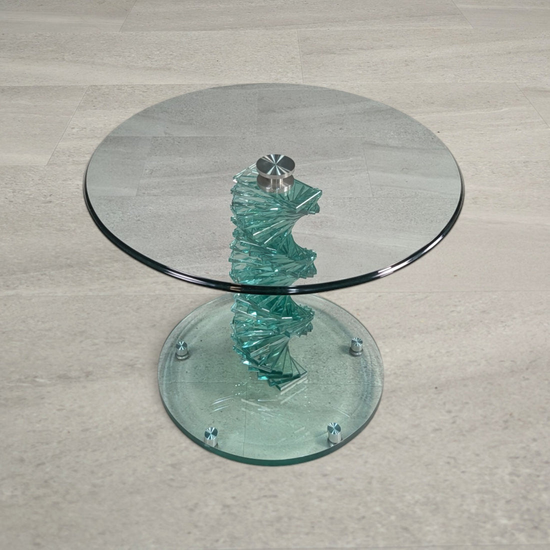Elevated view of round glass side table with twisting stacked glass pedestal